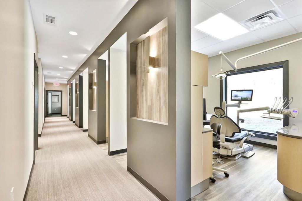 Interior view of hallway and dental rooms in Avella Family Cosmetic Dentistry in Peachtree City, GA.
