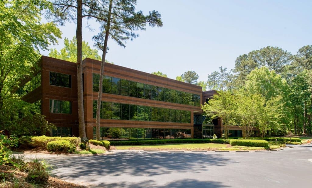 Exterior front side view of the Brookside building for 200 Westpark Drive, Peachtree City, GA.