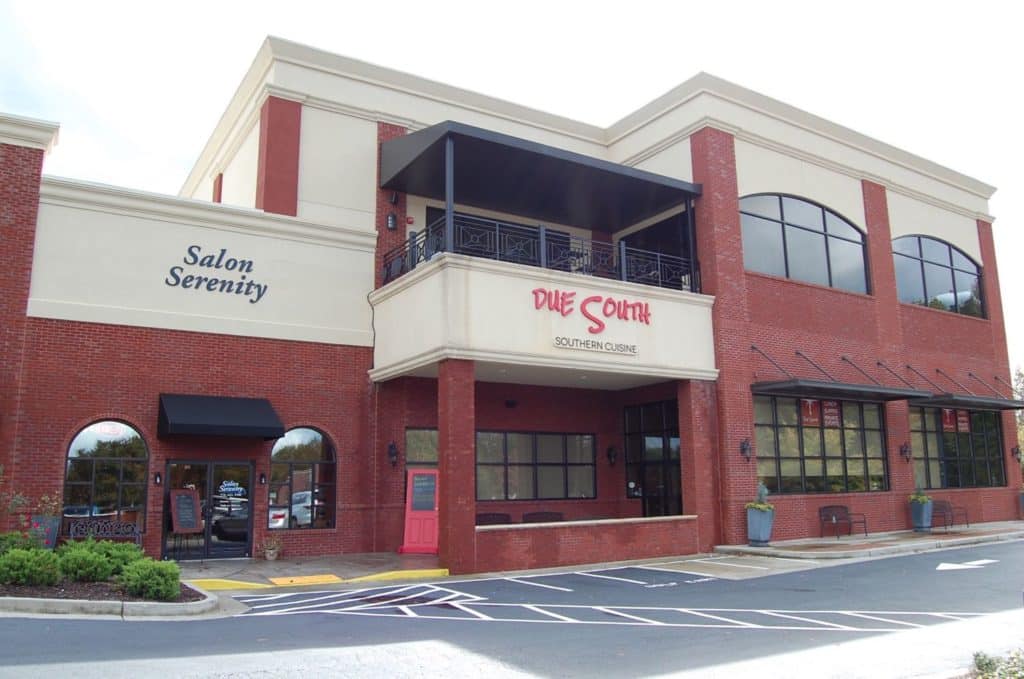 View of the two-story building exterior for Due South Southern Cuisine in Peachtree City, GA.