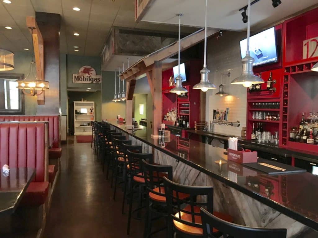 Interior view of bar and seating area in Due South Southern Cuisine in Peachtree City, GA.
