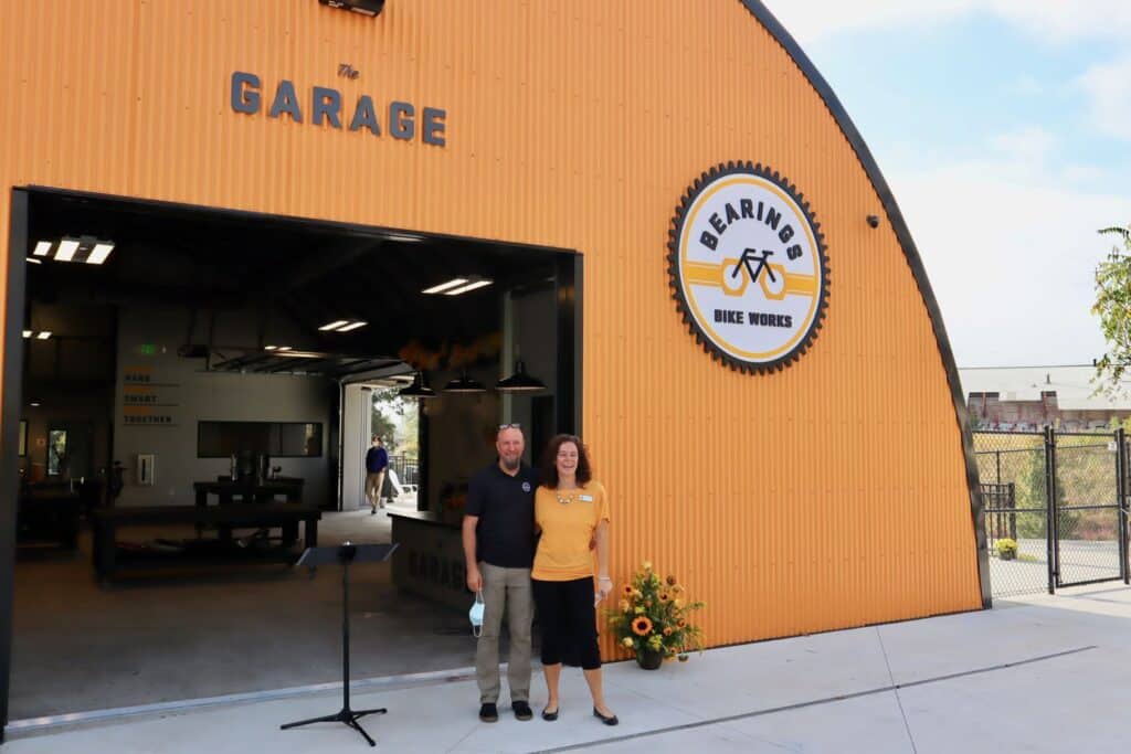 Bearings Bike Works, Tim and Becky O'Mara in front of The Garage.